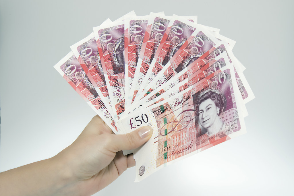Stack of British £50 banknotes — paid same day